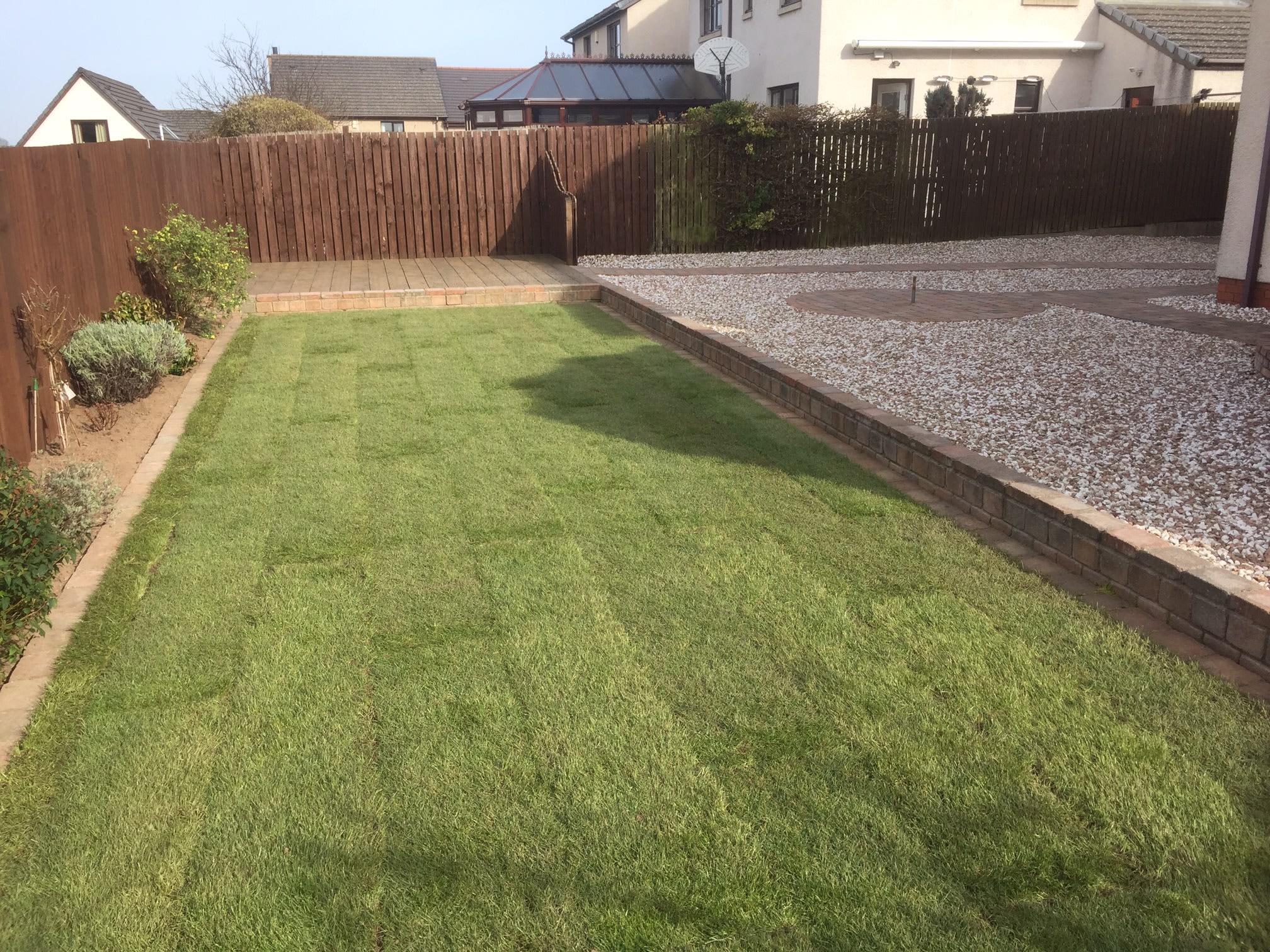 New lawn, decking and gravel beds in a rear garden